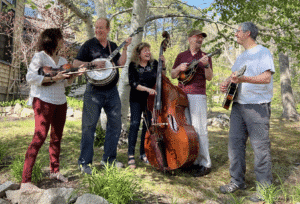Sharp Five Showcase Band outside with instruments